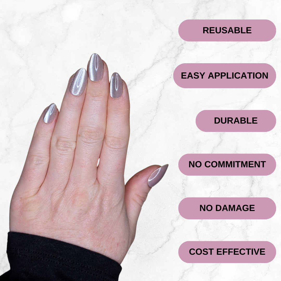 Left hand wearing almond shaped nails in a shiny chocolatey colour on a marble background.