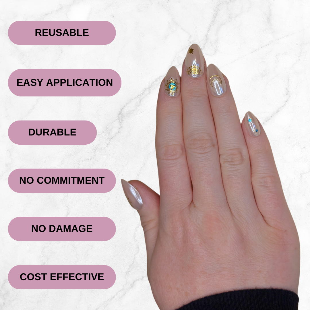Image of a right hand wearing Snap Nails in Signature collection of 5 almond shimmery, peachy nails gold details on a marble background. Reusable, easy application, durable, no commitment, no damage and cost effective are on the lefthand side.