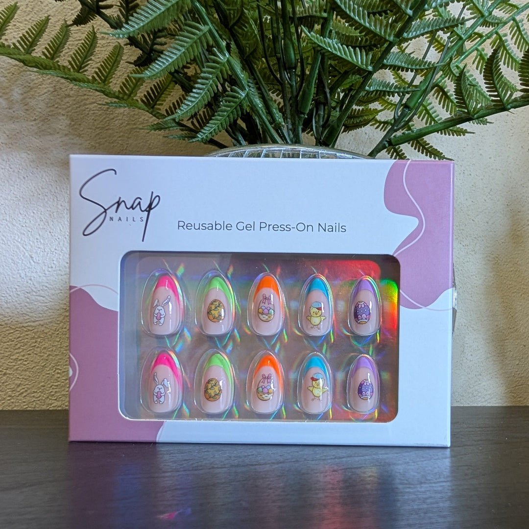 Image of a Snap Nails box with 10 almond press on gel nails with various tip colours and Easter designs.