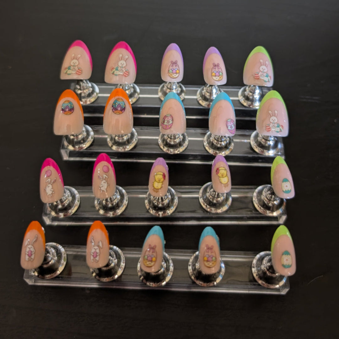 An image of 20 almond gel press ons with varying coloured tips and easter details.