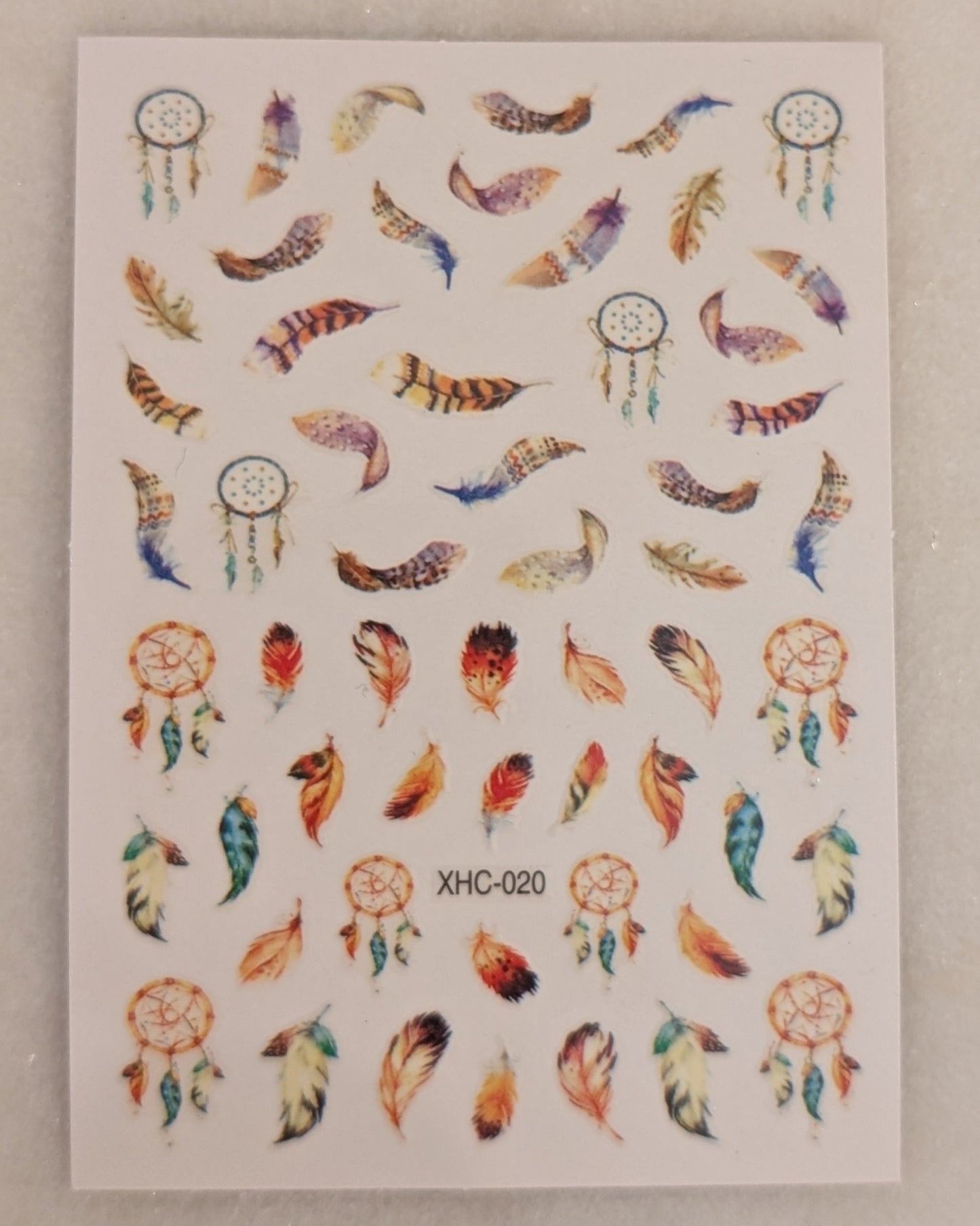 multi coloured, patterns and shaped feathers and circular dream catchers.