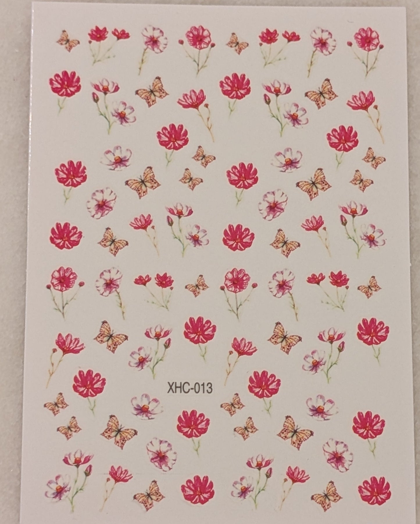 pink and red flowers with stems and yellow butterflies.