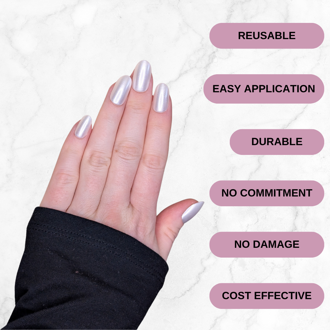 Left hand showing oval pearl coloured nails on a marble background. Reusable, easy application, durable, no commitment, no damage and cost effective.