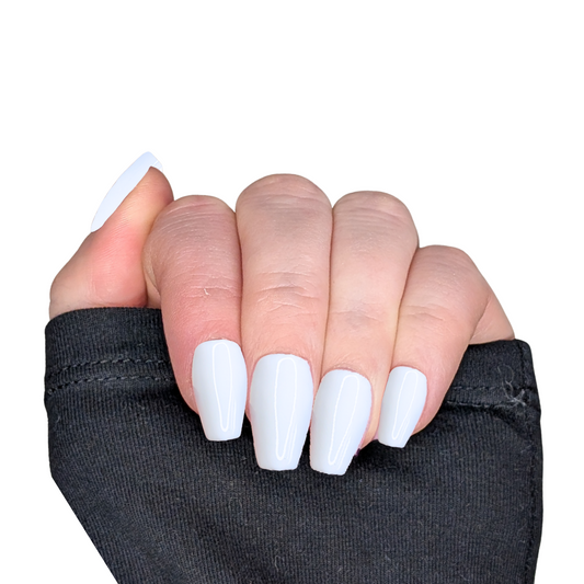 Picture of a left hand wearing medium coffin nails in a white gloss finish.