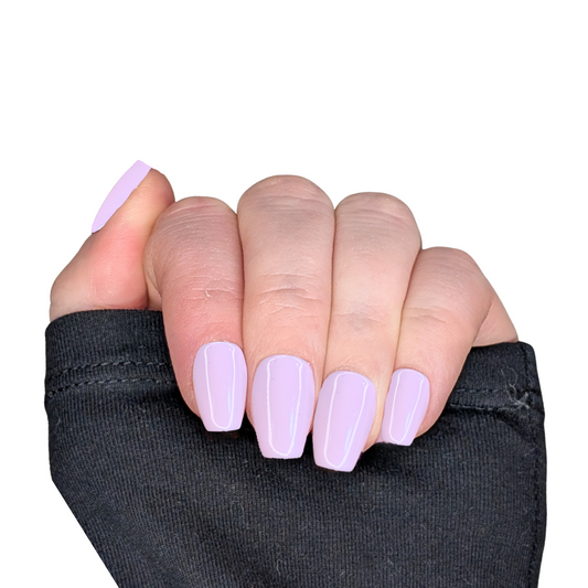Left hand showing extra short pale pink nails in a coffin shape