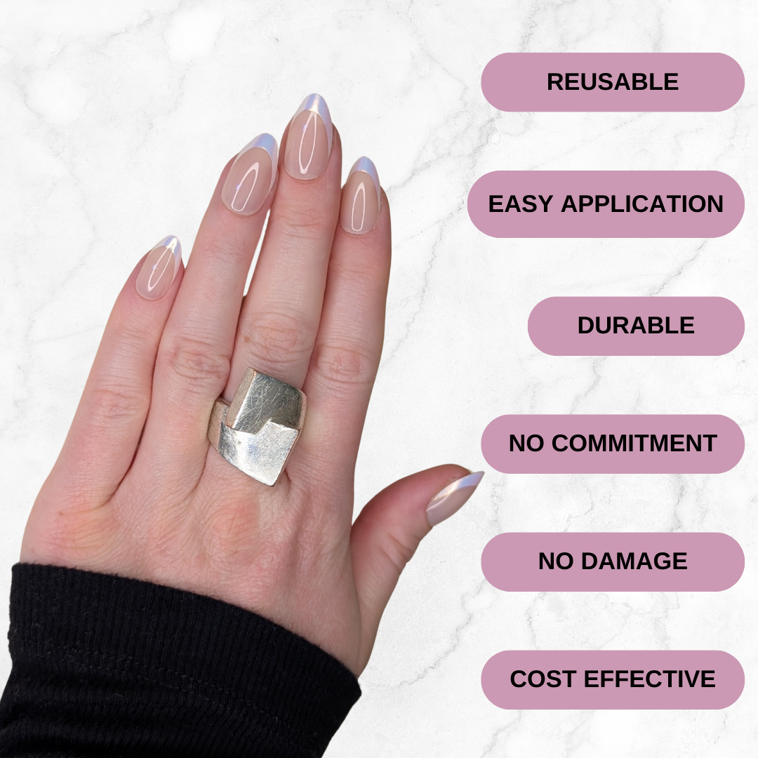 Left hand showing shimmery almond french tipped nails on a marble background. Reusable, easy application, durable, no commitment, no damage, cost effective.
