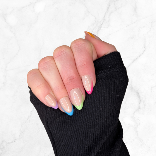 Right hand showing almond french tipped nails each with a different colour on a marble background.