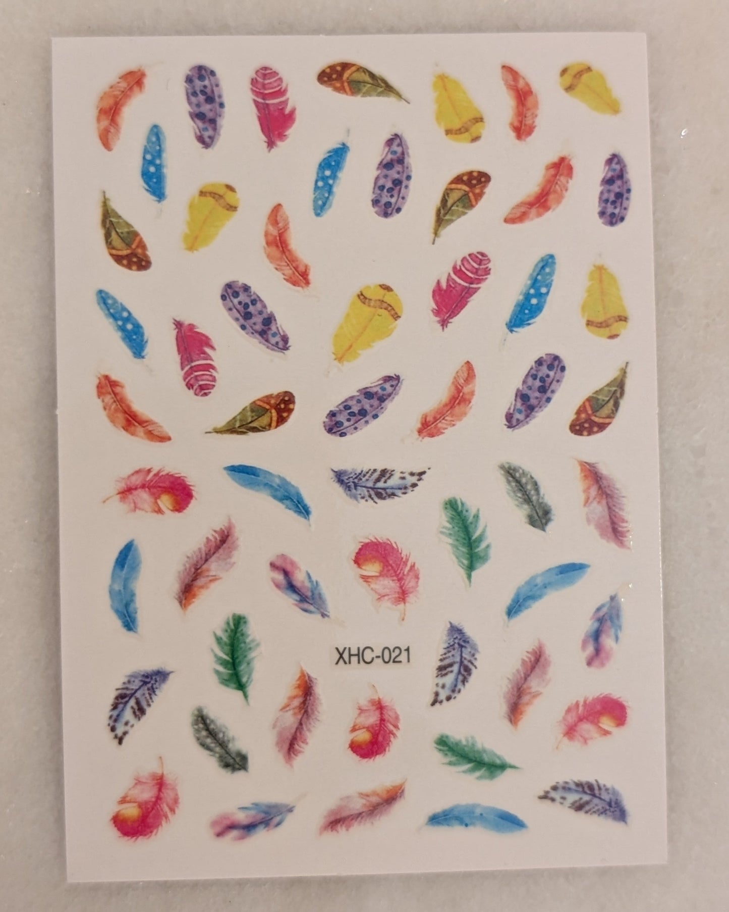 pink, blue, yellow, green and purple feathers of multiple fluffiness. 
