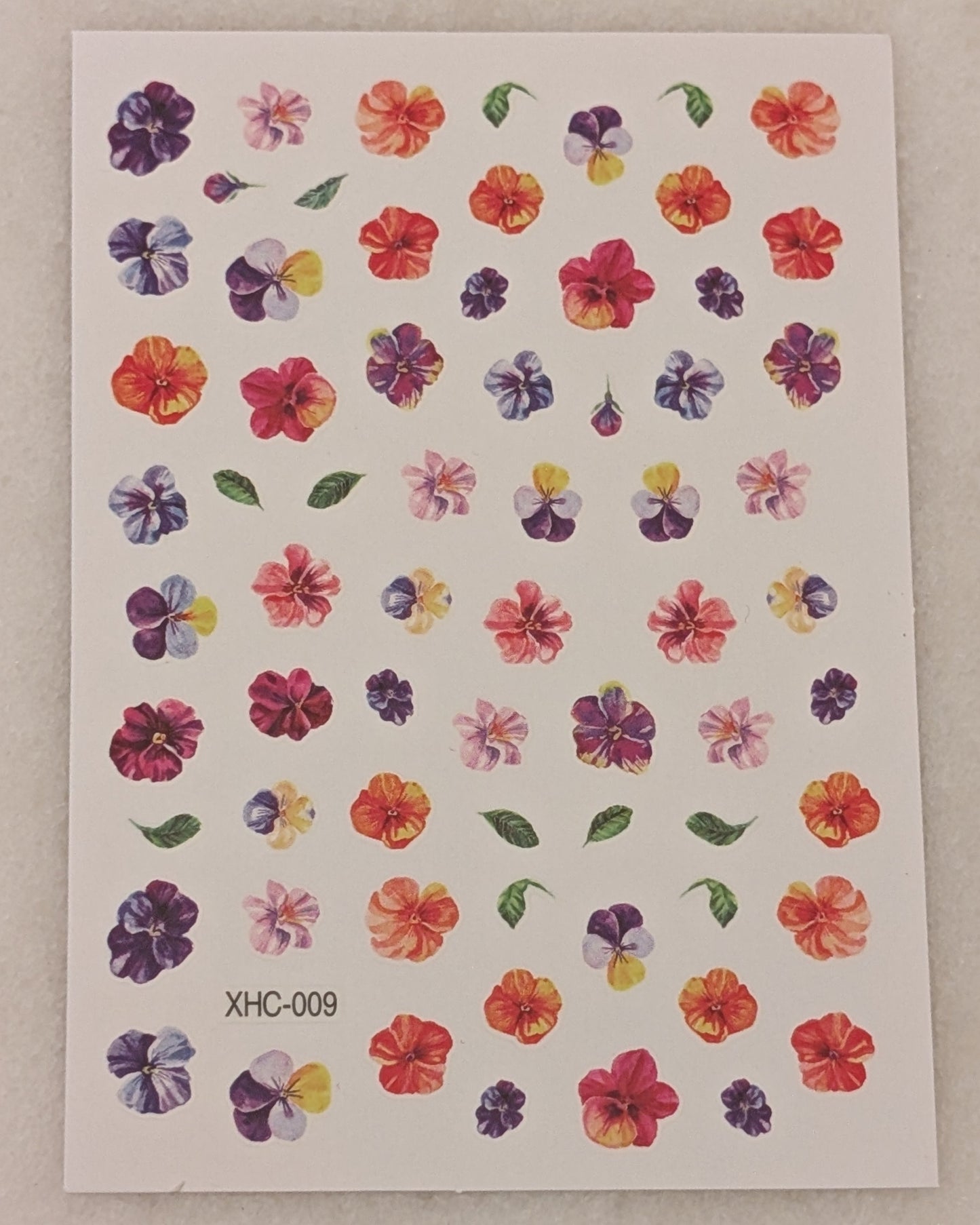 pink, orang and purple flowers with green leaves