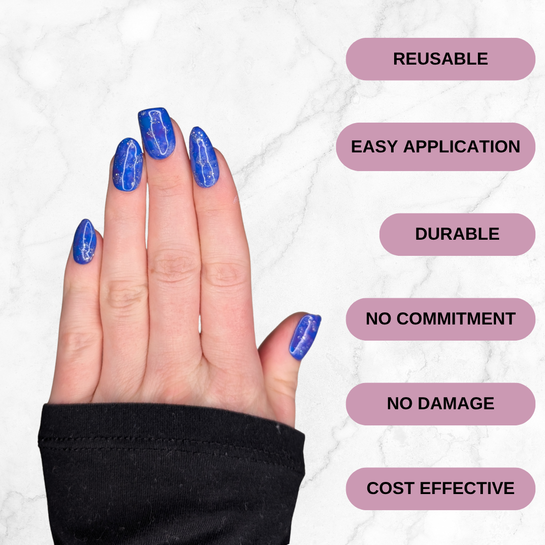 Hand wearing blue and purple marbled press-on nails with silver sparkle in a square, almond (long and short) oval shape. Text: Reusable, Easy application, durable, no commitment, no damage, cost effective.